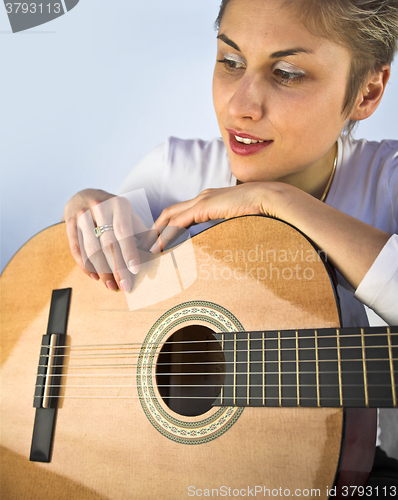 Image of woman and guitar