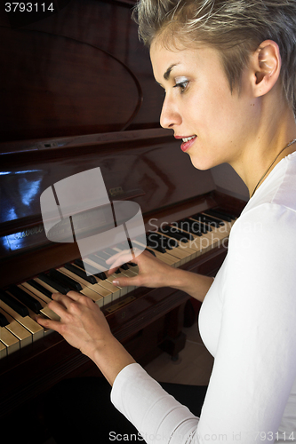 Image of woman and piano