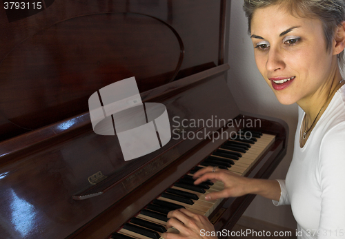 Image of woman and piano