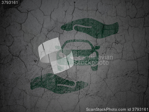 Image of Insurance concept: Car And Palm on grunge wall background