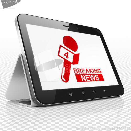 Image of News concept: Tablet Computer with Breaking News And Microphone on display