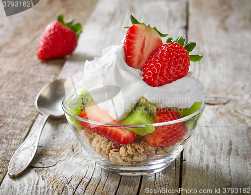 Image of fruits and berries with whipped cream