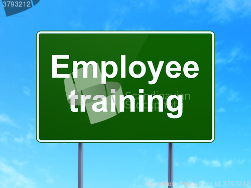 Image of Education concept: Employee Training on road sign background