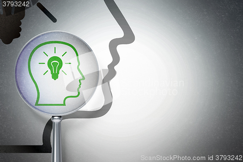 Image of Information concept:  Head With Lightbulb with optical glass on digital background