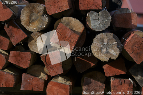 Image of Structure of red stacked wood boards.