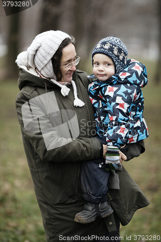 Image of Woman holding her small son