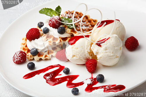 Image of Vanilla ice cream and waffles with fresh berries