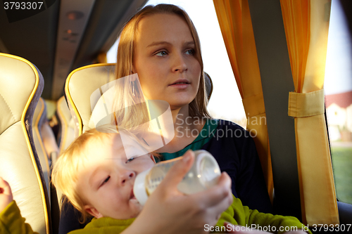 Image of Mother with kid in the bus.