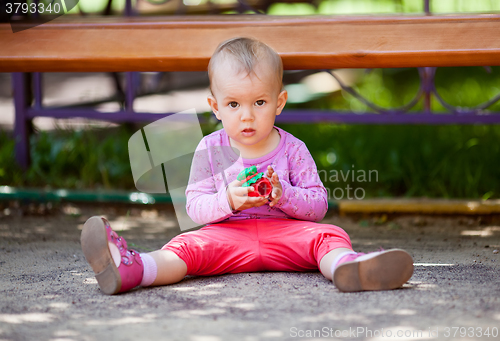 Image of Small baby playing with toy