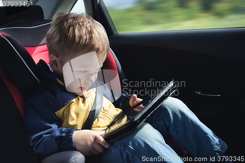 Image of Child in the car with tablet PC