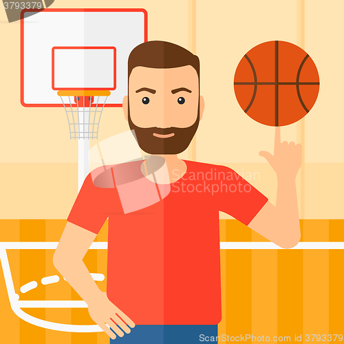 Image of Basketball player spinning ball.