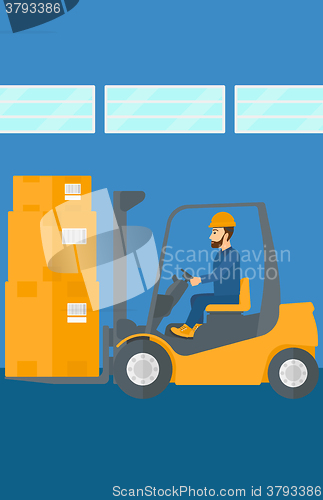 Image of Warehouse worker moving load by forklift truck.