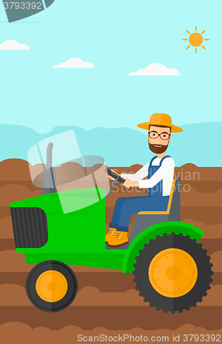 Image of Farmer driving tractor.