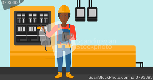 Image of Electrician with electrical equipment.