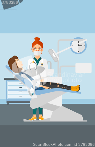 Image of Dentist and woman in dentist chair.