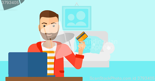 Image of Man making purchases online.