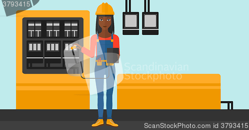 Image of Electrician with electrical equipment.