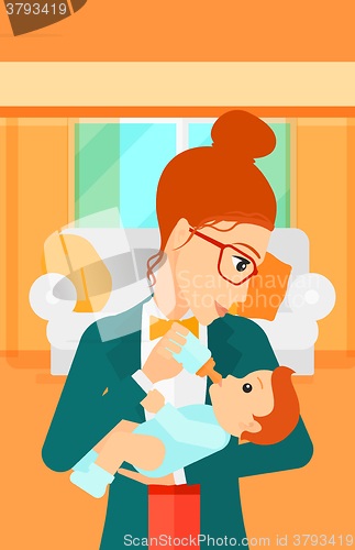 Image of Woman feeding baby.