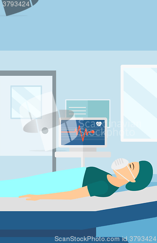 Image of Patient lying in hospital bed with heart monitor.