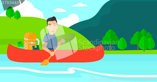 Image of Man canoeing on the river.