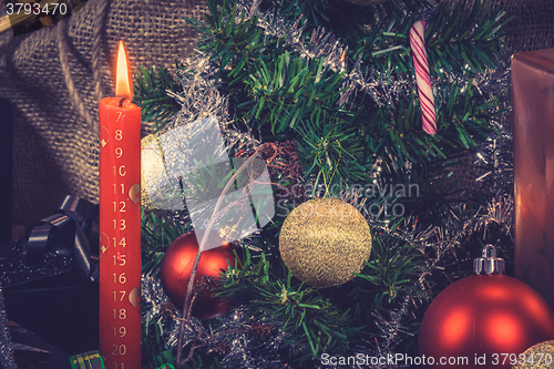 Image of Red Christmas candle with a calendar