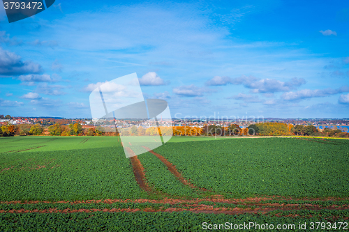 Image of Tracks on a field near a city