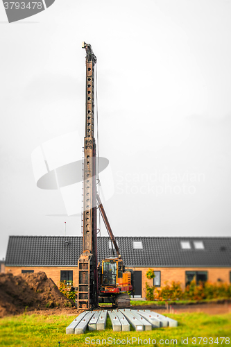 Image of Piling machine in a single family neighborhood