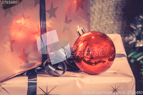 Image of Christmas presents with a red baubel