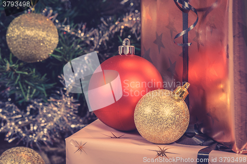 Image of Shiny Christmas baubles with presents