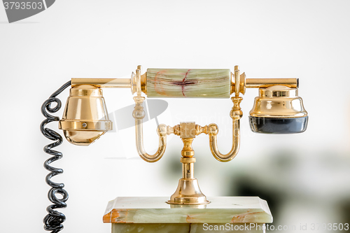 Image of Golden telephone in retro style