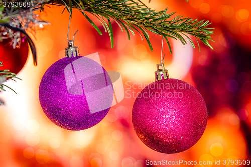 Image of Christmas baubles in violet colors