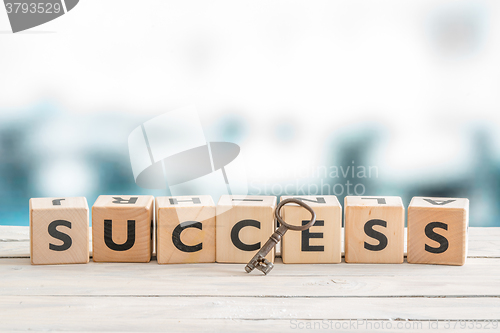 Image of Key to success on a table