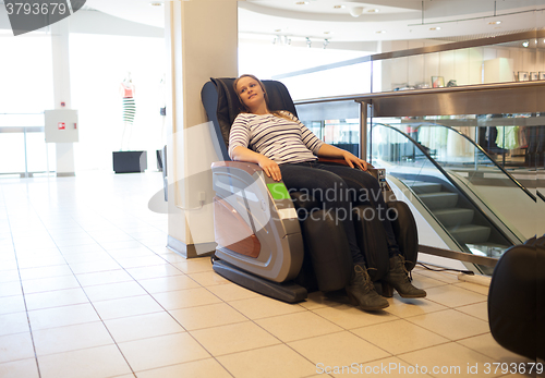 Image of Woman in the massage chair