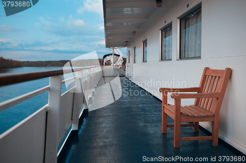 Image of Wooden chairs on the deck of cruise liner