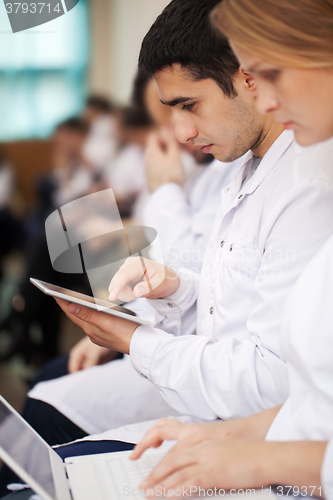 Image of Medical students with modern devices on the lecture