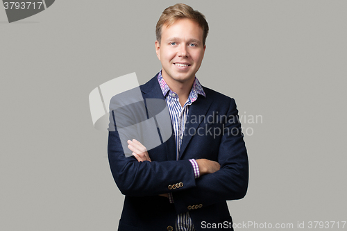 Image of Young Businessman in Suit