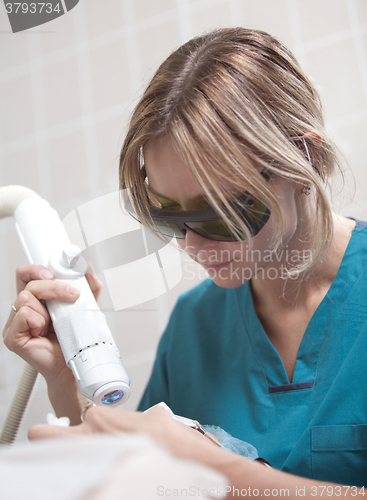 Image of Facial treatment with laser in cosmetology clinic
