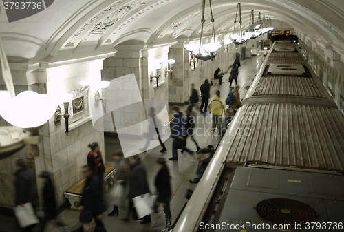 Image of Blurred people on subway platform.