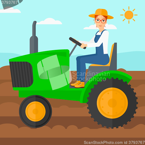 Image of Farmer driving tractor.