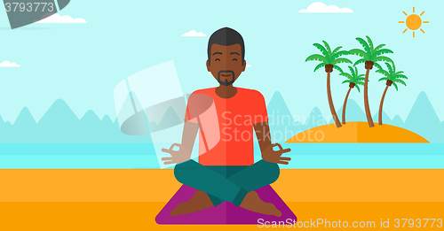 Image of Man meditating in lotus pose.