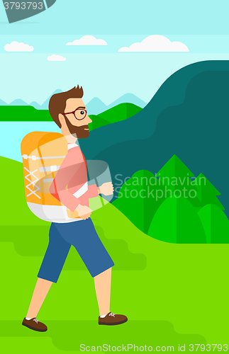 Image of Man with backpack hiking.