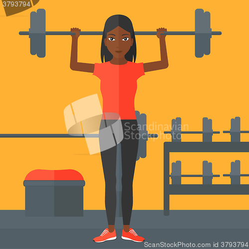 Image of Woman lifting barbell.