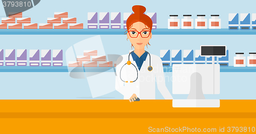 Image of Pharmacist at counter with computer monitor.