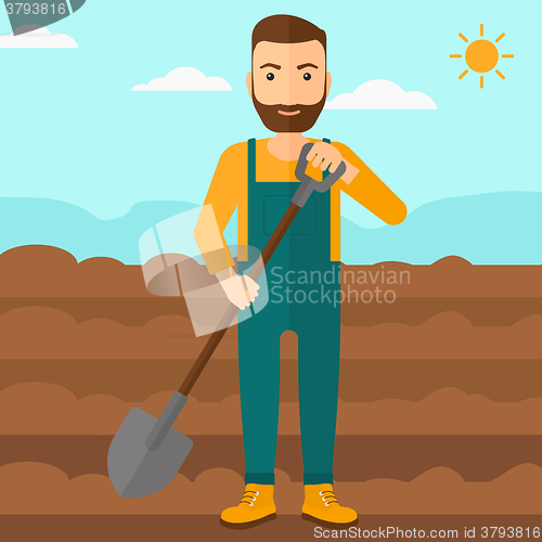 Image of Farmer on the field with shovel.