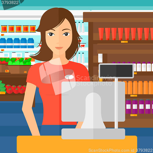 Image of Saleslady standing at checkout.