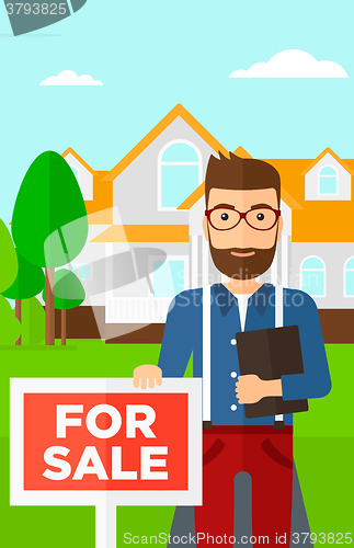 Image of Real estate agent offering house.