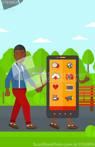 Image of Man walking with smartphone.