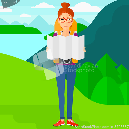 Image of Backpacker looking at map.