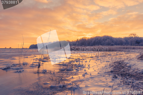 Image of Ice on a lake in the sunrise