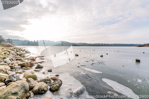 Image of Frozen lake with rocks